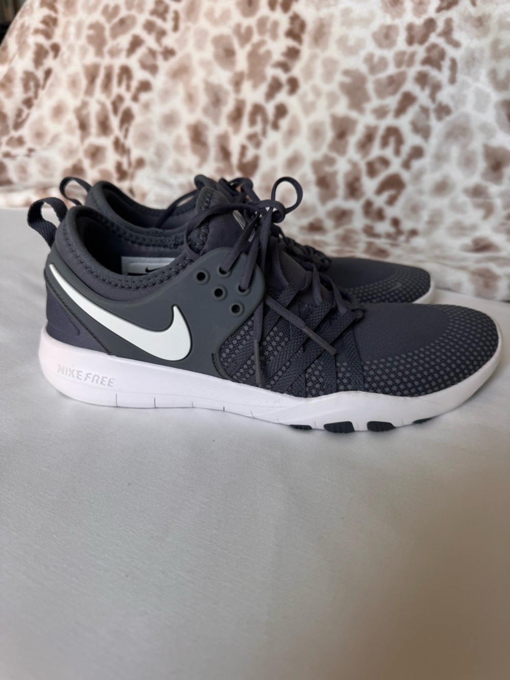 Nike Women’s Gray and White Free RN Sneakers